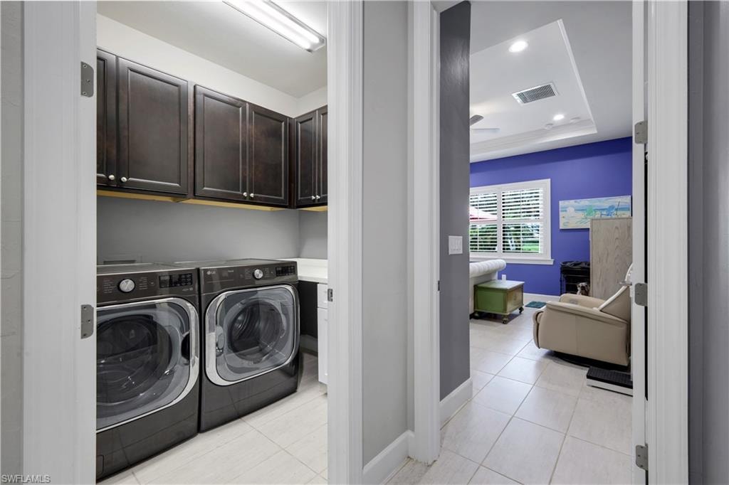 Dedicated laundry area with sink, featuring dark wood-finish cabinetry, ample countertop space.