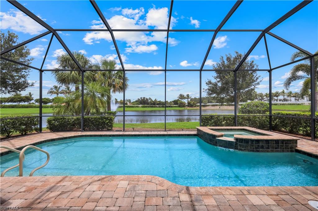Screened lanai featuring a swimming pool and integrated spa