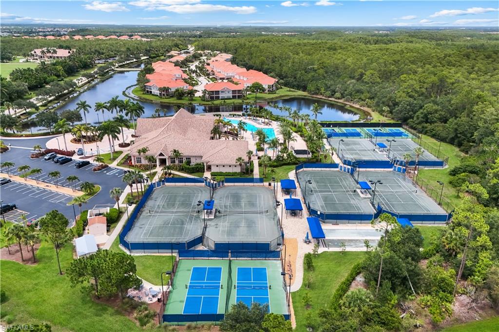 PICKLEBALL & TENNIS facilities featuring multiple courts, a central clubhouse, and a resort-style swimming pool