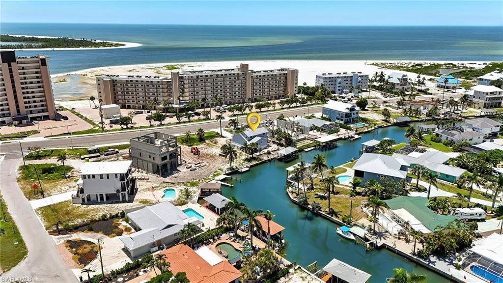 Bird's eye view of a large body of water and apartment complex / building - Virtually Edited Image