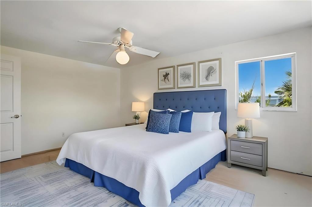 Bedroom 2 featuring ceiling fan - Virtually Staged and Edited Image