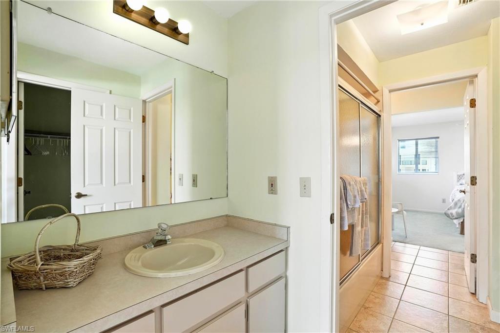 Bathroom featuring vanity and tile patterned floors - Virtually Edited Image