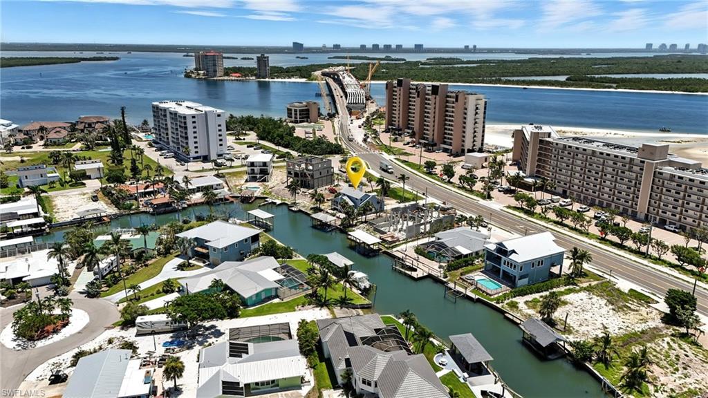 Drone / aerial view of city skyline and a nearby body of water - Virtually Edited Image
