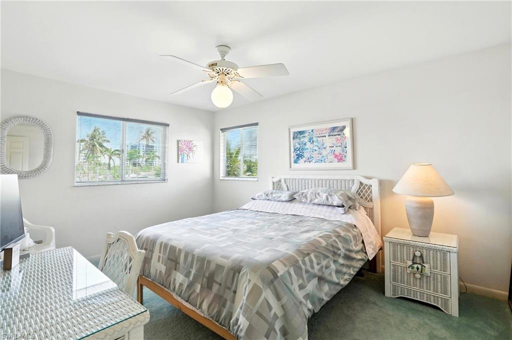 Carpeted bedroom 3 featuring baseboards and ceiling fan - Virtually Edited Image. 2nd floor