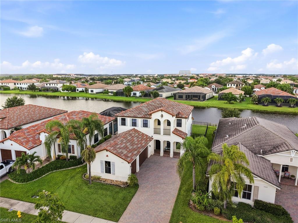 Mediterranean-inspired architecture with a two-story design and a detached garage