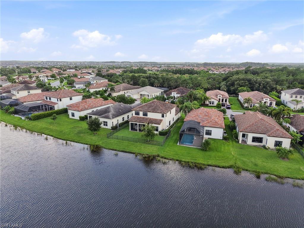 Waterside residential community featuring Mediterranean-inspired homes with tile roofs