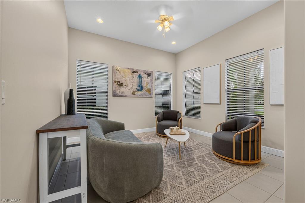 Neutral paint tones complement the recessed lighting and ceiling fan fixture