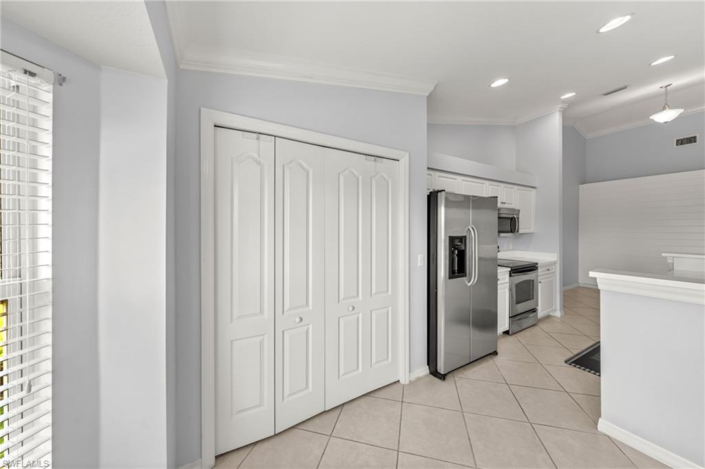 Bi-fold panel doors with a smooth white finish
