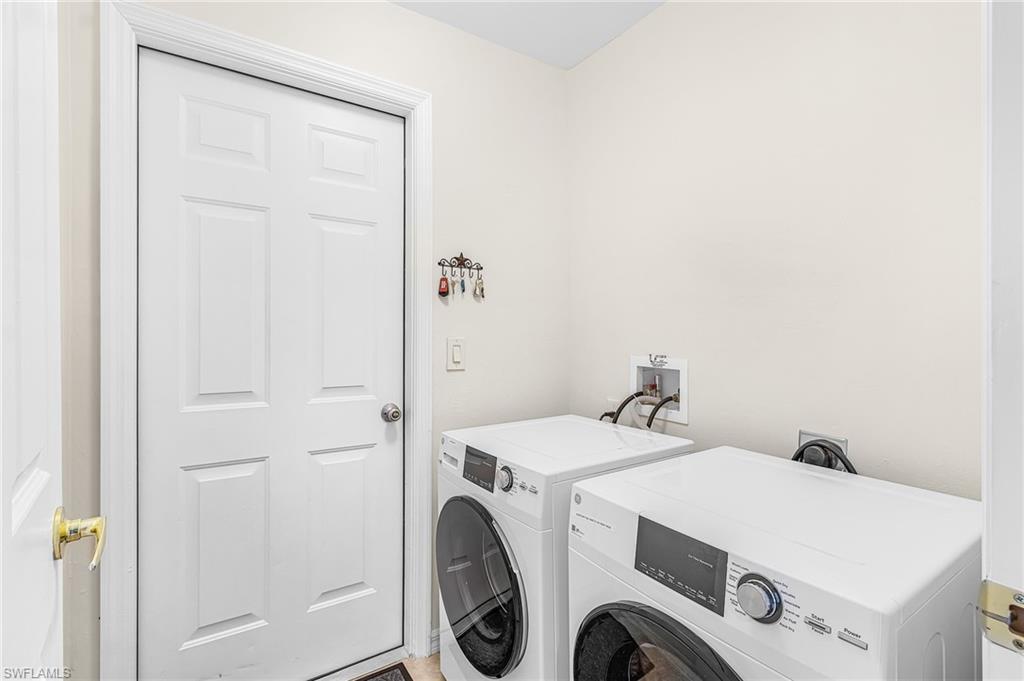 Laundry room with new appliances, leads out to your attached 2 car garage.