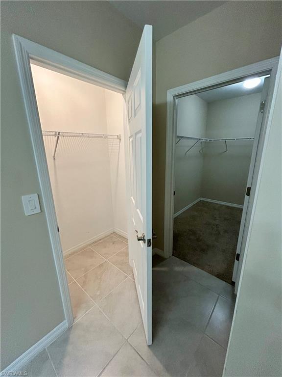 Two walk-in closets featuring wire shelving systems