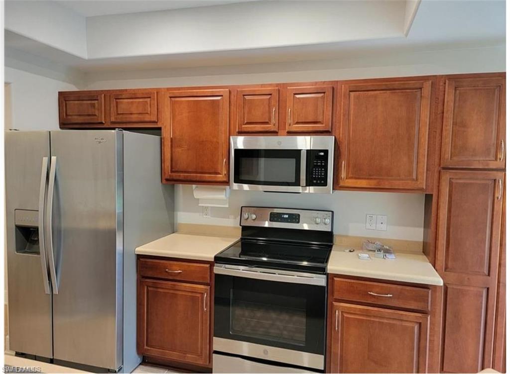 Kitchen with appliances with stainless steel finishes