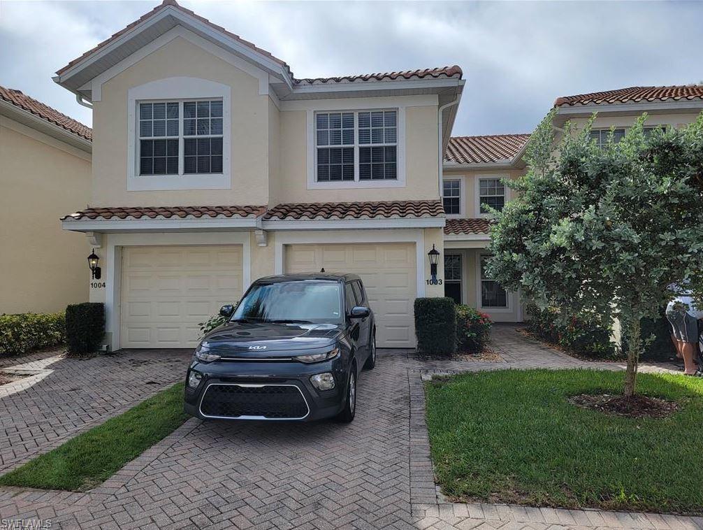 Mediterranean / spanish-style house featuring a garage