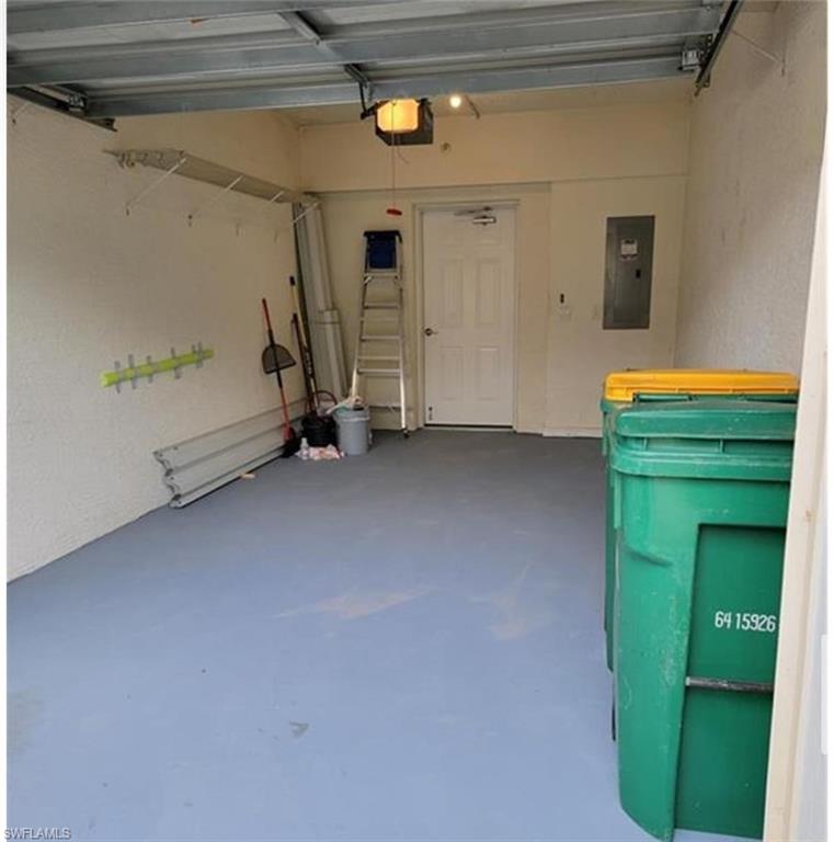 Garage with a garage door opener and electric panel