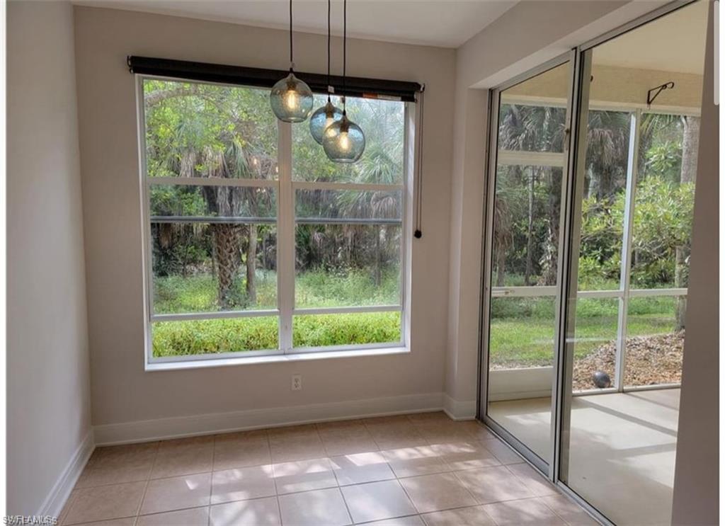 Unfurnished dining area featuring light tile patterned flooring