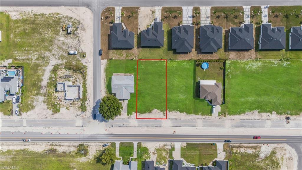 Aerial perspective of suburban area with property parcel outlined