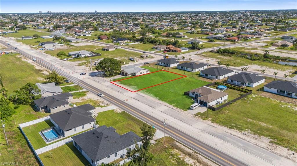 Aerial perspective of suburban area featuring property parcel outlined