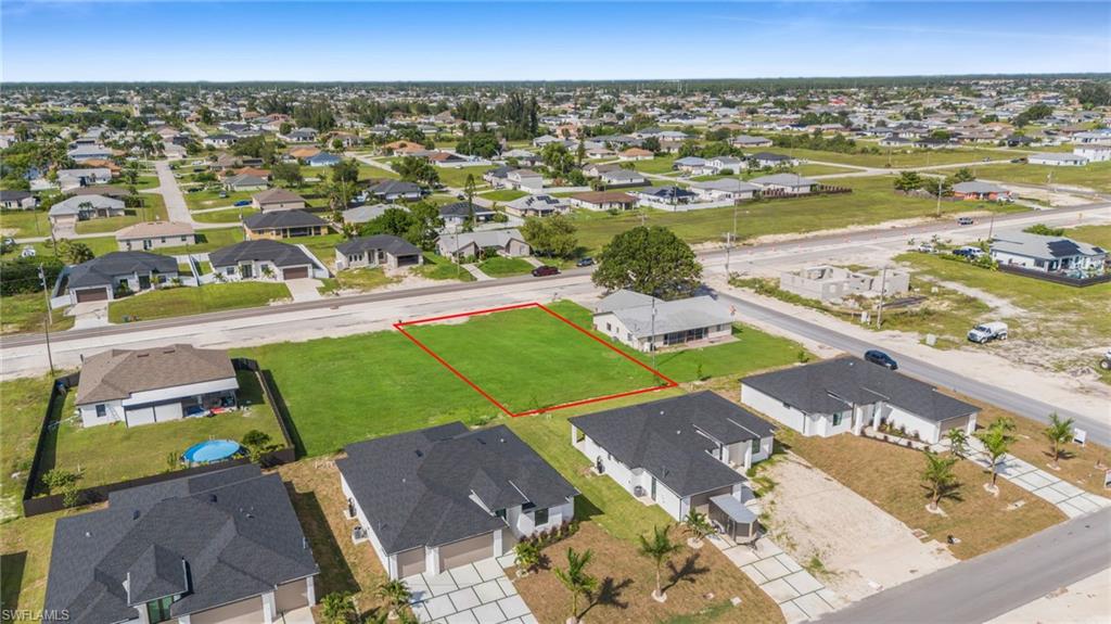 Aerial perspective of suburban area with property parcel outlined