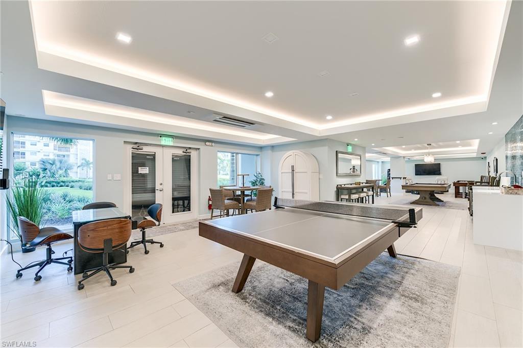 Recessed lighting and tray ceilings illuminate the open-concept common area