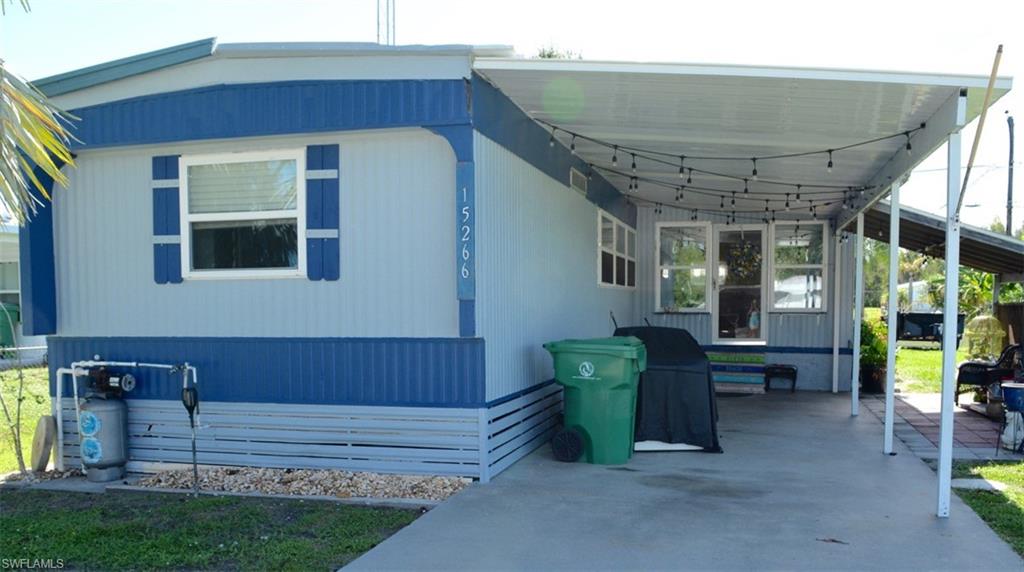 Light blue exterior featuring blue trim and white window frames