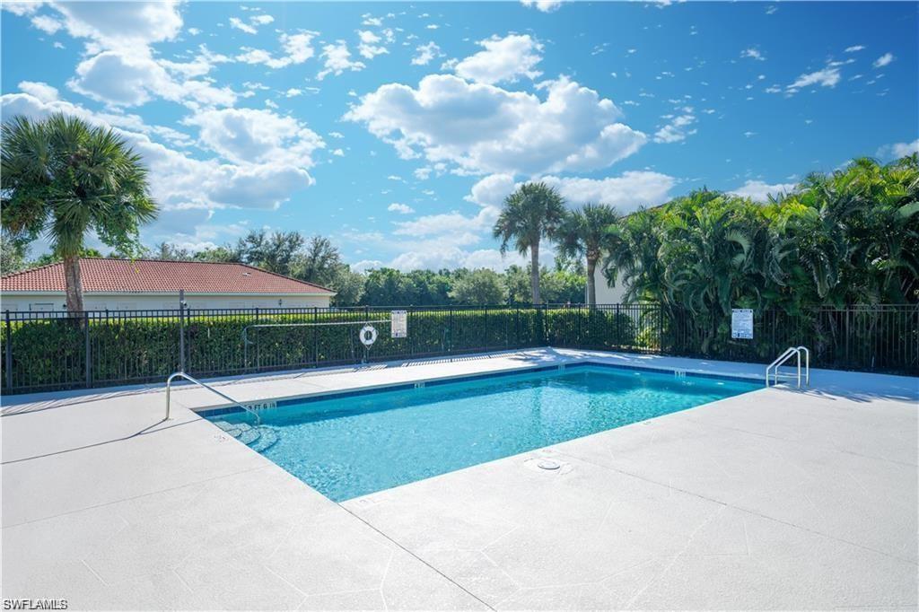 Rectangular swimming pool featuring integrated steps and two entry ladders