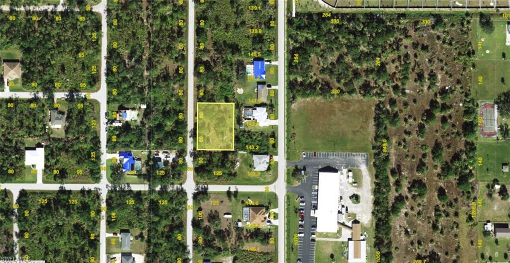 Aerial Property Survey. Highlighting the parcel boundary and surrounding land use