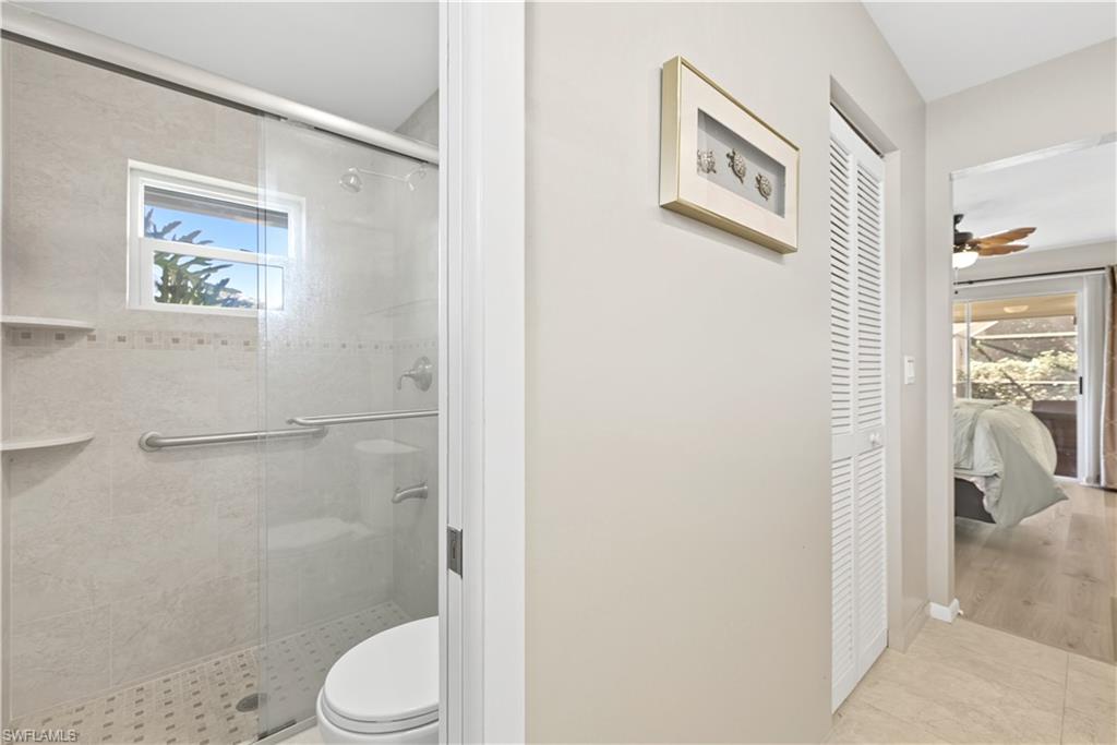 Bathroom with a shower stall, a closet, and ensuite bath