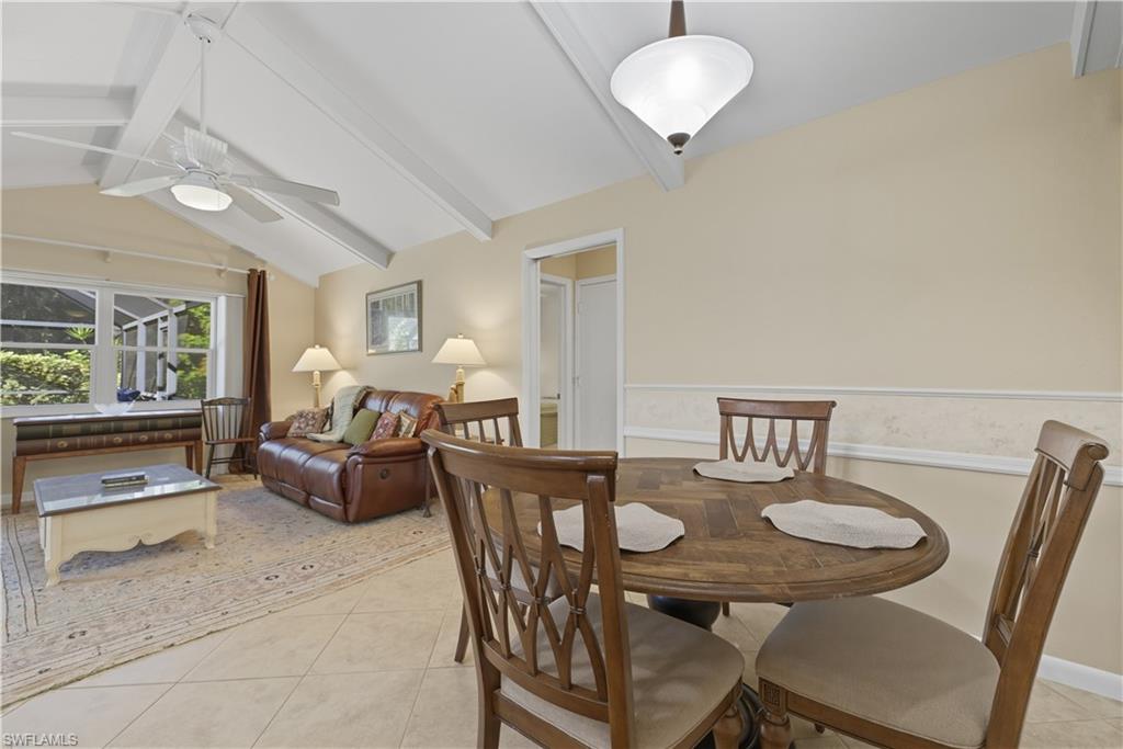 Dining room featuring light tile patterned floors and ceiling fan