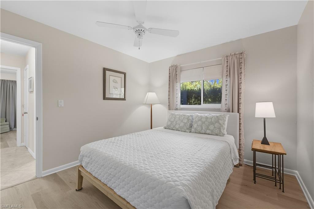 Bedroom with light wood finished floors and ceiling fan
