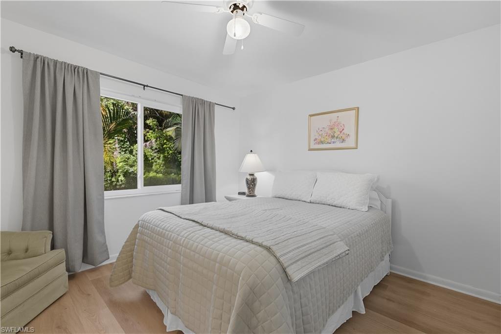 Bedroom featuring light wood-style flooring and ceiling fan