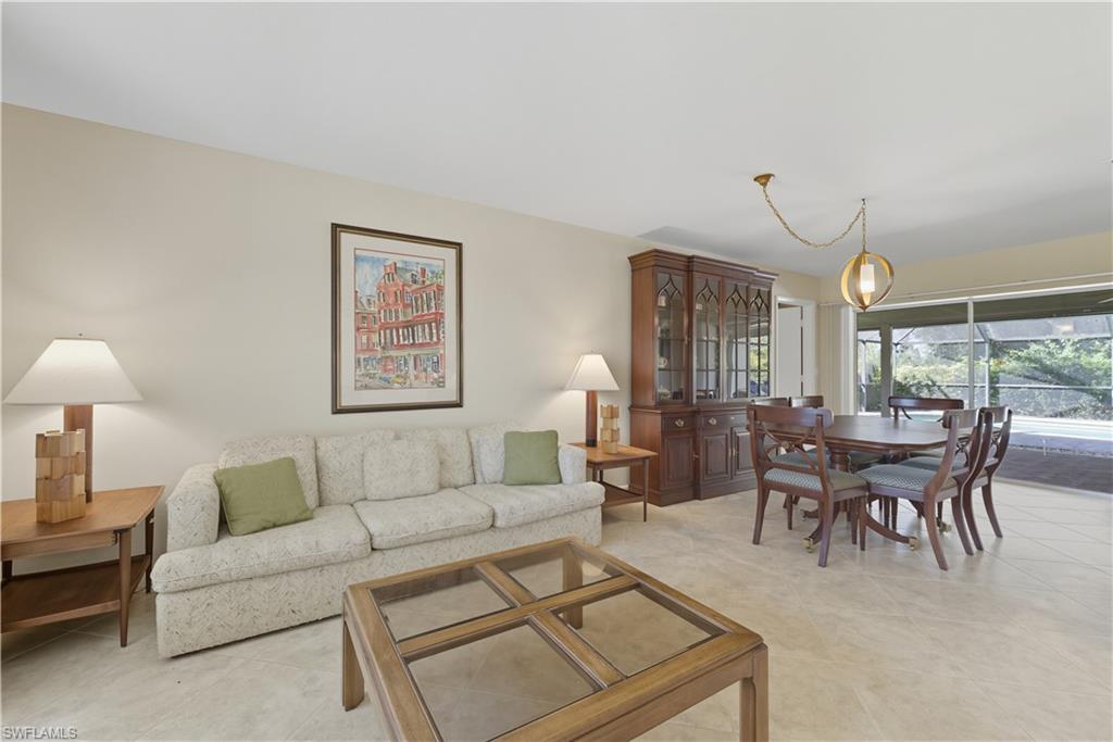 Living room with light tile patterned flooring