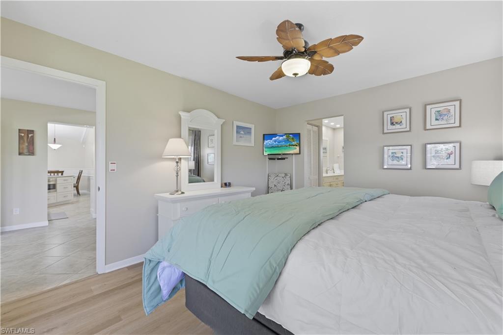 Bedroom with light wood finished floors and ceiling fan