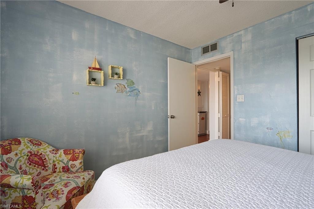 Bedroom featuring a textured ceiling