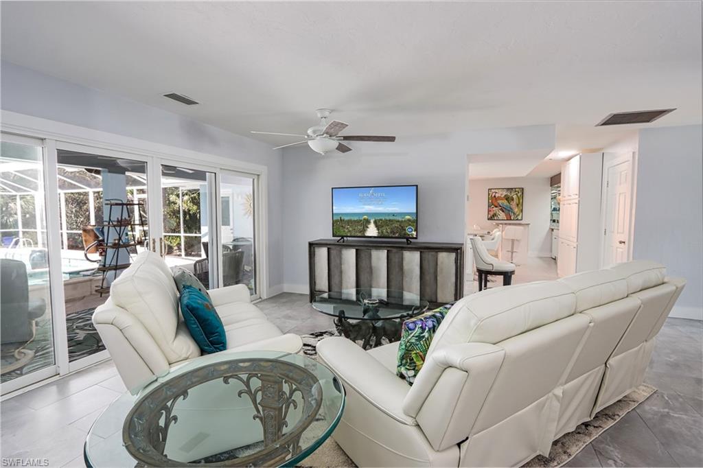 Tiled living room with ceiling fan