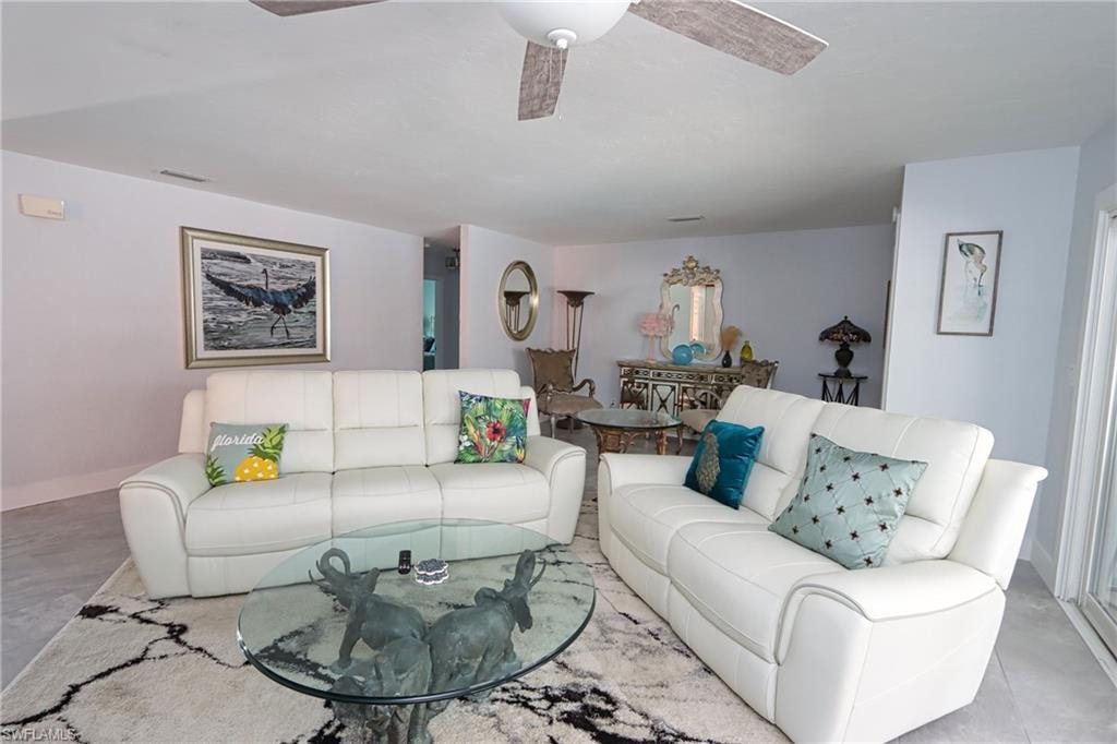 Living room featuring ceiling fan