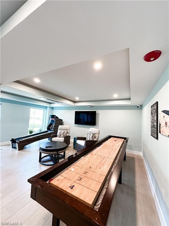 Rec room featuring a raised ceiling, wood finished floors, billiards, and recessed lighting