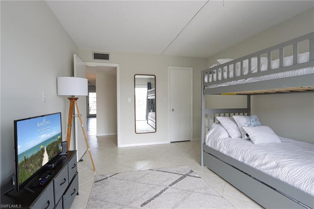 Bedroom featuring light tile floors
