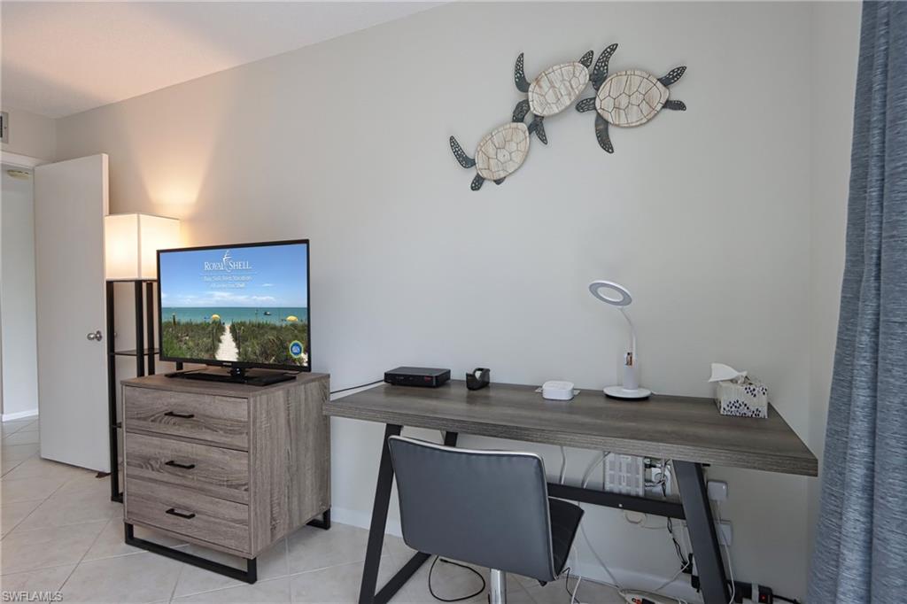 Office area featuring light tile flooring