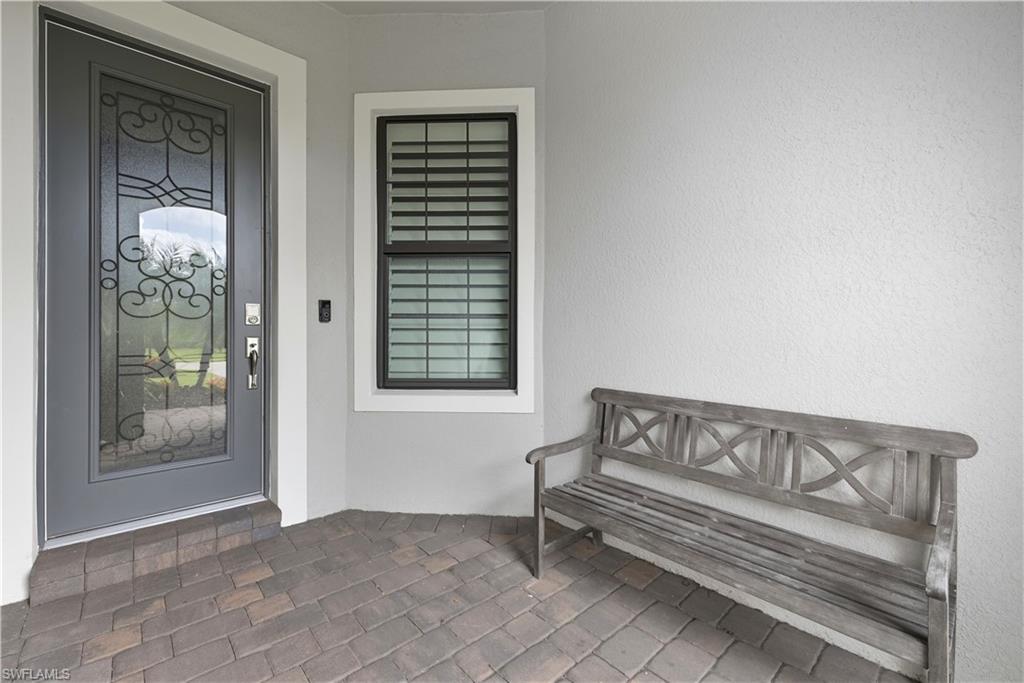 Doorway to property with stucco siding