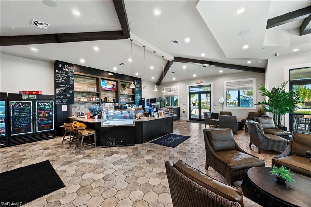 Reception with a community bar and recessed lighting