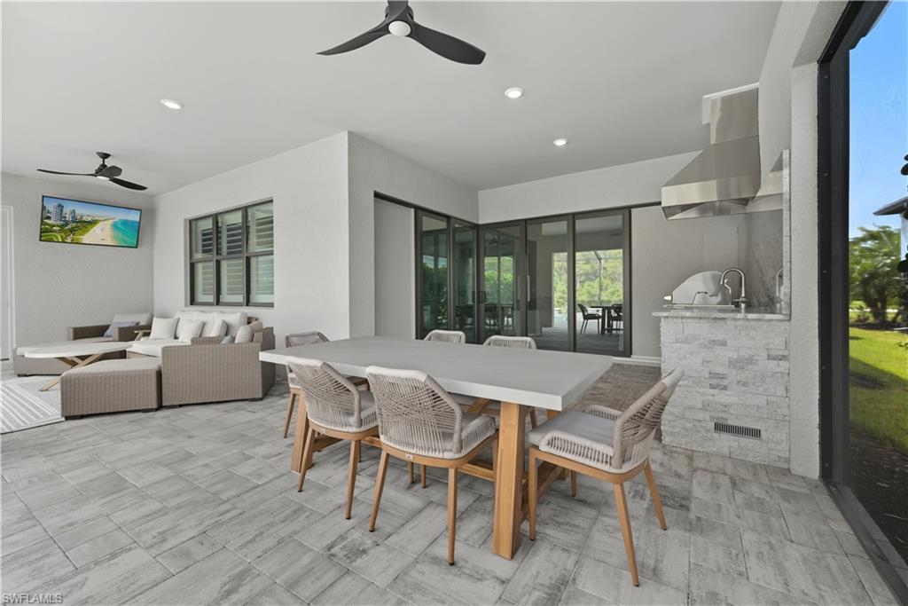 Dining space with recessed lighting and a ceiling fan