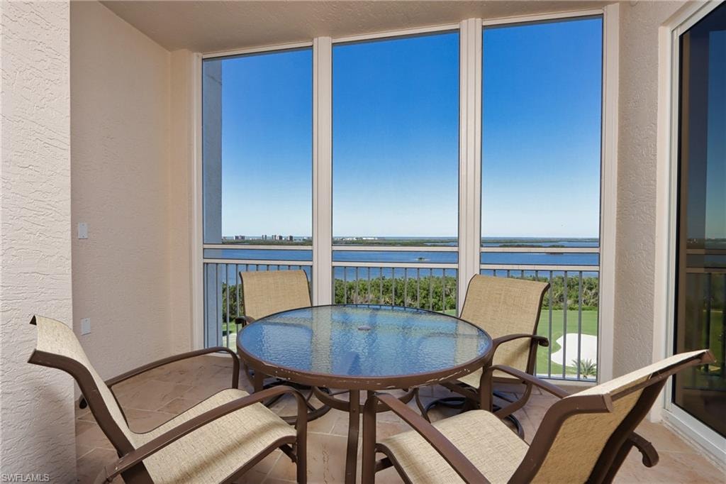 Sunroom with a water view