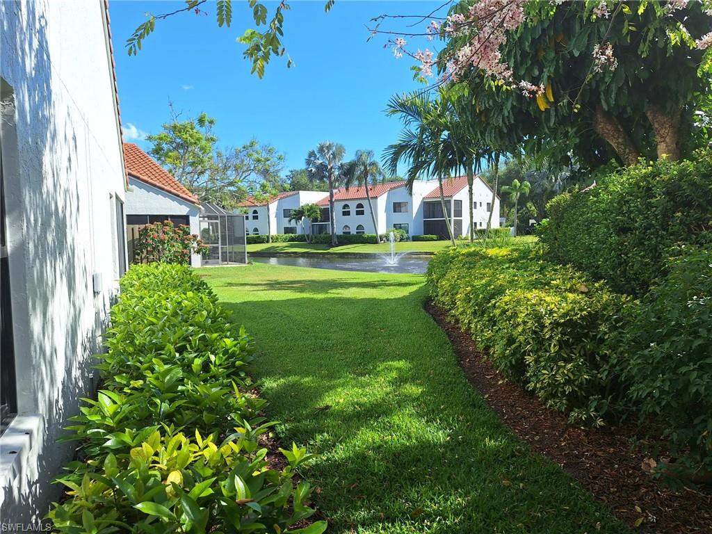 View of back yard with a oblique water view