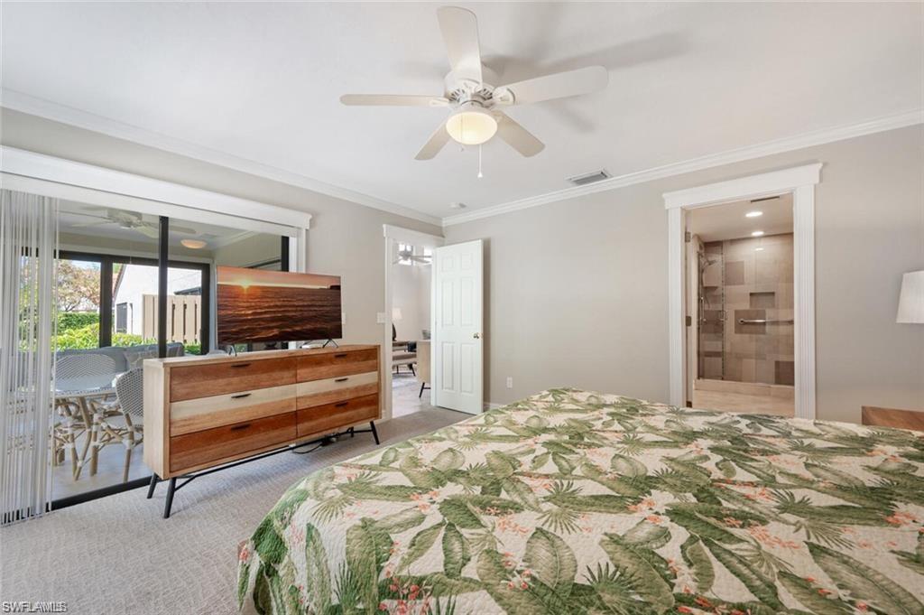 Primary Bedroom featuring carpet, ceiling fan, crown molding, and access to outside