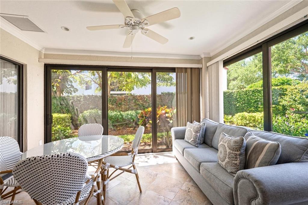 Sunroom featuring a wealth of natural light and ceiling fan