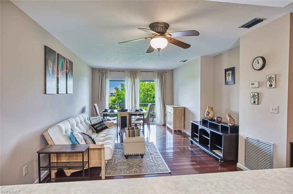 Living room with a ceiling fan and wood finished floors