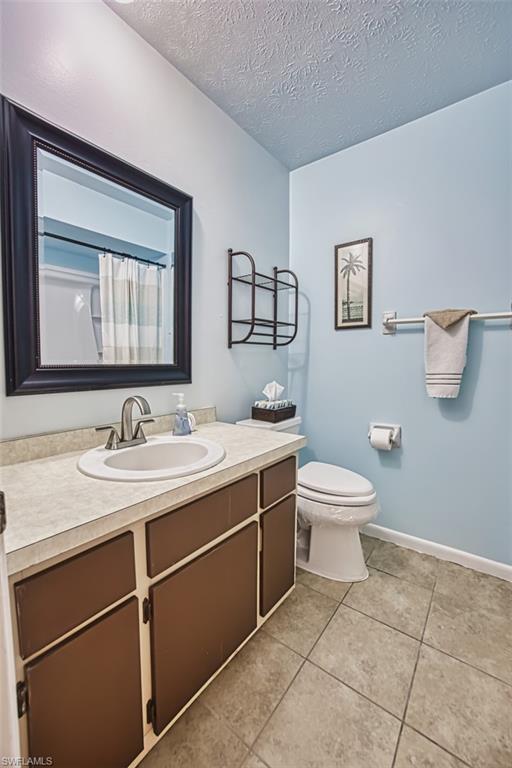 Bathroom featuring vanity, and a shower