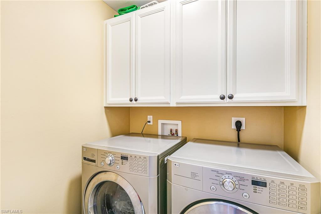 White shaker-style cabinetry with dark hardware - Virtually Edited Image