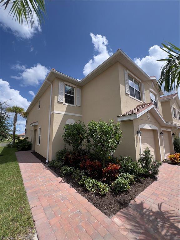 View of front of property featuring a garage