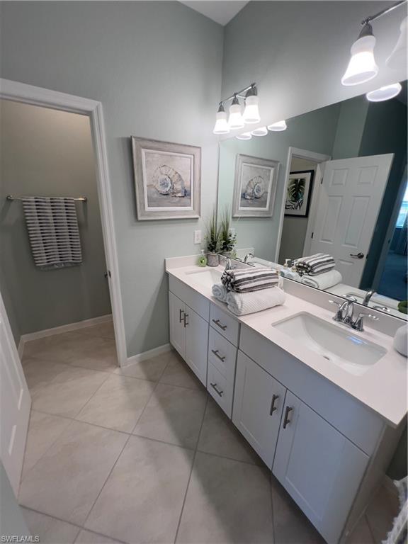 Bathroom featuring vanity and tile patterned flooring