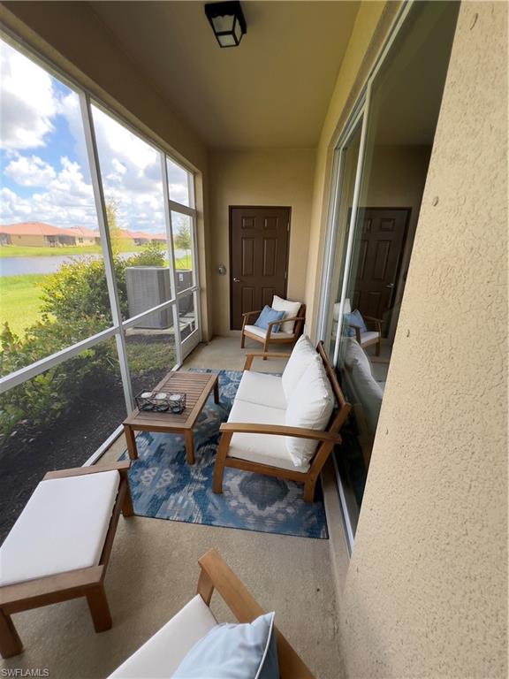 Sunroom with a water view